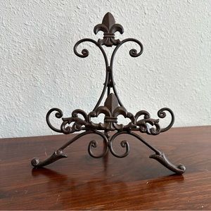 Ornate metal display easel. Used to display art, plates, cookbooks, or photos.